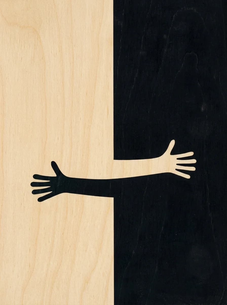 Two arms embracing across a split of pale birch and black stained wood