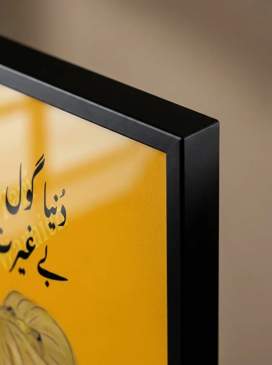 Close-up of the black floating frame corner against the yellow canvas