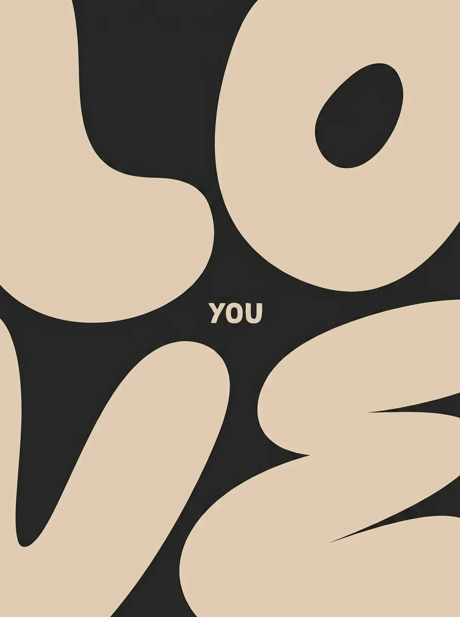 Swollen sand letterforms spelling Love on charcoal with the word You at the centre
